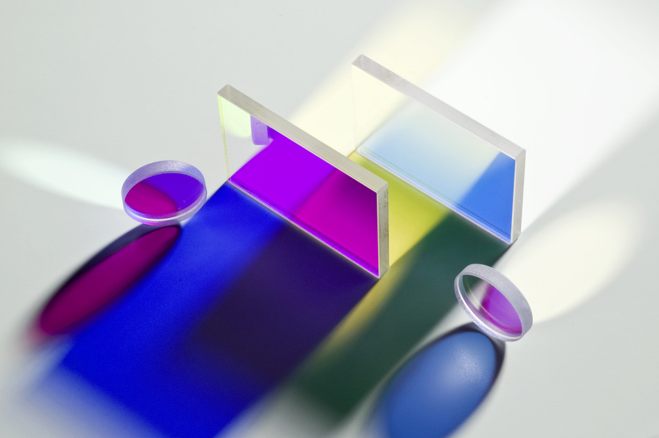 Colorful coated optical glass filters showing color transmission on white background
